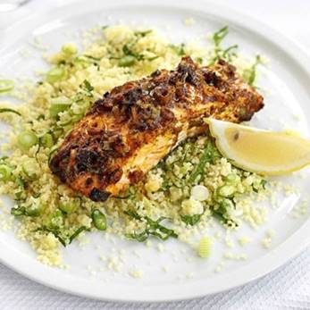 serving of baked salmon with cauliflower and pine nuts
